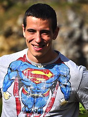 Beefy european jock showing his strong muscles