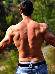 Beefy european jock showing his strong muscles