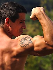 Beefy european jock showing his strong muscles