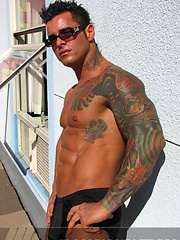 Jock poses outside and jerks off on bed