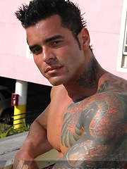 Jock poses outside and jerks off on bed
