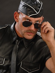 Hunky dad posing in solder and leather uniform