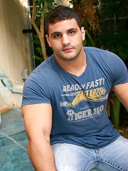 Strong stud relaxing in the pool and baring his body