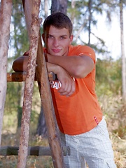 Beefy jock takes off his clothes in the wood