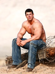 Sexiest muscle hunk posing outdoor