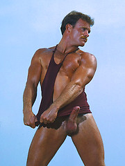 Muscled hunk shows his body and cock
