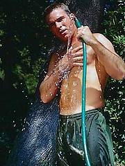 Toned hunk working out outdoors