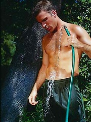 Toned hunk working out outdoors