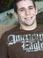 Naked college jock posing before camera