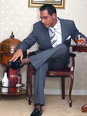 Hunky office guy relaxing after hard work day