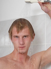 Sweet blonde boy soaped his nude body