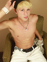 Blond twink Angel Villanueva tugs on his thick cock.