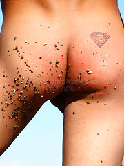 Superboy Alec relaxing on the beach